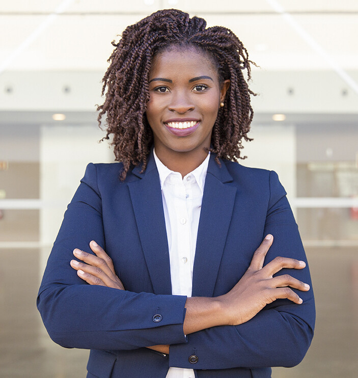 Happy successful business leader posing near outside