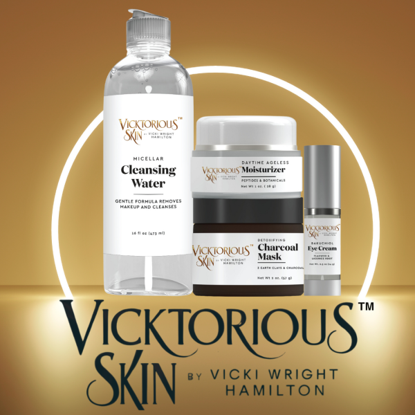 Vicktorious Skin by Vicki Wright Hamilton skincare collection featuring Vivacious Micellar Cleansing Water, Vitalizing Daytime Ageless Moisturizer, Vicktory Detoxifying Charcoal Mask, and Vibrant Bakuchiol Eye Cream on a gold background.